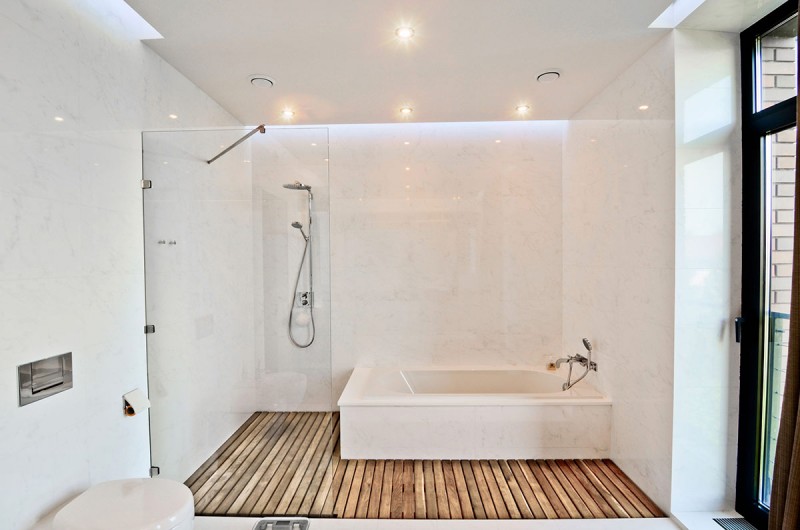 white bathroom glass shower wood flooring large residence 135084 800x530
